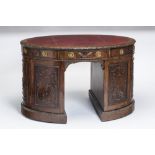 A GEORGIAN STYLE OVAL MAHOGANY PARTNER'S DESK, c.1900, the banded top lined in red leather and