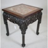 A CHINESE PADOUK WOOD JARDINIERE STAND, c.1900, of square form with inset red marble top, the frieze