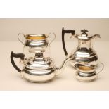 A COMPOSITE THREE PIECE SILVER TEA SERVICE, makers Viners, Sheffield 1920 and 1921, (teapot), of