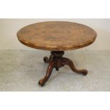 A VICTORIAN WALNUT CENTRE/BREAKFAST TABLE, the moulded edged circular tip up top with burr