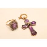 A VICTORIAN AMETHYST CROSS PENDANT, the shaped and carved cabochon stones close back set and centred