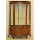 A MAHOGANY DISPLAY CABINET, early 20th century, of D form, the moulded cornice over frieze with