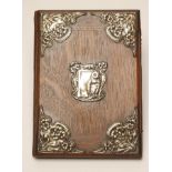 AN EDWARDIAN SILVER MOUNTED ART NOUVEAU OAK BLOTTER, maker's mark JA & S, Birmingham 1905, the