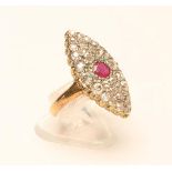 A DIAMOND AND RUBY PLAQUE RING, the marquise panel pave set with numerous old brilliant and rose cut