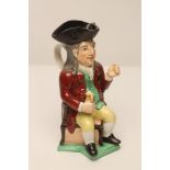 A STAFFORDSHIRE POTTERY "SQUIRE" TOBY JUG, late 19th century, wearing a black tricorn hat, brown