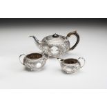 A BACHELOR'S LATE VICTORIAN THREE PIECE SILVER TEA SERVICE, makers Aldwinkle & Slater, London