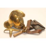 A BRASS FIREMAN'S HELMET, late19th/early 20th century, with crossed axe emblem, dragon crest and