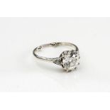 A SOLITAIRE DIAMOND RING, the brilliant cut cushion stone of approximately 2.5cts, claw set to