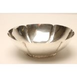 A SILVER FRUIT BOWL, makers Barracloughs, London 1933, of lobed circular form, raised on a low foot,
