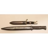 A HITLER YOUTH DAGGER, with 5 1/2" blade Stamped RZM M7/13, chequered two piece plastic grip with