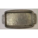 A TUDRIC PLANISHED PEWTER PEN TRAY, c.1900, designed by Archibald Knox, of rounded oblong form,