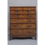 A GEORGIAN MAHOGANY TALL CHEST, c.1800, the rounded edged top over two short and five long