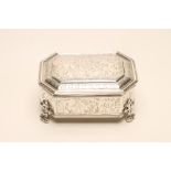 A SILVER DRESSING TABLE BOX, makers Goldsmiths & Silversmiths, London 1912, of canted oblong form