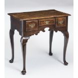 A GEORGIAN OAK AND MAHOGANY BANDED LOW BOY, 18th century, the moulded edged plank top over arched