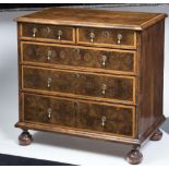 AN OYSTER VENEERED CHEST, late 17th/early 18th century, with holly banding and stringing, quarter