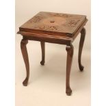 AN ANGLO INDIAN CARVED HARDWOOD ENVELOPE CARD TABLE, c.1900, the baize lined top with flower