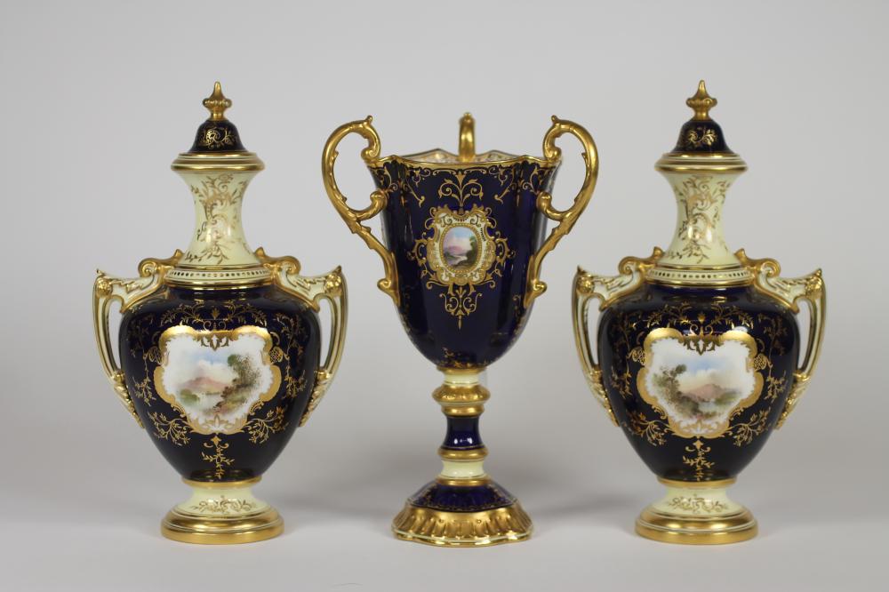 A MATCHED COALPORT CHINA MANTEL GARNITURE, c.1920's, comprising a pair of two handled vases and