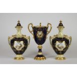 A MATCHED COALPORT CHINA MANTEL GARNITURE, c.1920's, comprising a pair of two handled vases and