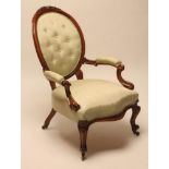 A VICTORIAN WALNUT FRAMED SALON CHAIR button upholstered in pale green watered silk, oval padded