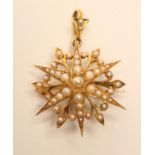 A VICTORIAN GOLD AND PEARL STAR BROOCH/PENDANT, with detachable loop and bar, unmarked, 1 1/4"