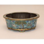 A CHINESE CLOISONNE ENAMEL BOWL of quatrefoil form with slightly everted rim and raised upon four