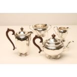A FOUR PIECE SILVER TEA AND COFFEE SERVICE, makers Adie Bros., Birmingham 1929, of panelled