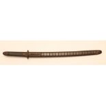 A JAPANESE WAKIZASHI, possibly late Koto, the 20 1/4" blade with undulating hamon, floral relief