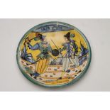 A MONTELUPO MAIOLICA PLAQUE, 19th century, of circular form, painted in typical palette with men