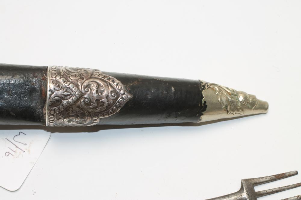 A SCOTTISH DIRK, 19th century, the fullered blade with serrated back edge, shaped wood grip - Image 4 of 5