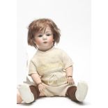 A Gebruder Heubach bisque head boy character doll with blue glass sleeping eyes, open mouth and