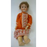 An Alt Beck & Gottschalk bisque head doll with brown glass sleeping eyes, open mouth and teeth,