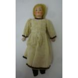 A German bisque shoulder head doll with fixed blue glass eyes, closed mouth, blonde mohair wig,