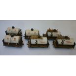 Six handmade four wheel United Dairies milk tankers finished in white with U.D. to tank sides,