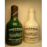 A Tobermory Malt whisky display "bottle" in fibre glass, 58" high, and another similar half