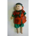 A Japanese Motschann type composition boy doll with fixed glass eyes, silk outfit, 13" high (Est.