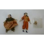 A pair of bisque male and female dolls house dolls with painted faces and moulded hat/hair, 3 1/4" -