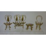 A suite of French style dolls house furniture, early 20th century, in gilt metal with flower