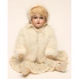 A Kestner bisque head doll with brown glass sleeping eyes, open mouth and teeth, blonde mohair