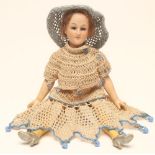 A rare Armand Marseille bisque head lady doll with blue glass sleeping eyes, closed mouth, brown