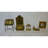 Two embossed brass dolls house furniture items comprising a Dutch style bureau bookcase and a lady's