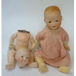 An Armand Marseille bisque head baby doll with sleeping glass eyes (to fix), moulded hair,