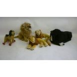 Two Pedigree recumbent lions, possibly Pedigree, 16" long, an Althans seated lion, 15" high, a