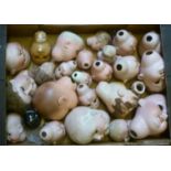 Twenty five assorted bisque composition and china dolls heads, some with inset eyes, some damage (