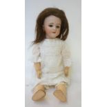 A French Dep bisque head doll with blue glass sleeping eyes, open mouth and teeth, pierced ears,