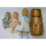 A composition doll with painted face and bent limbed body, 10" high, a Rosebud plastic baby doll,