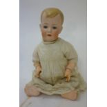 A German character boy doll, probably Bruno Schmidt, with blue glass sleeping eyes, closed mouth,