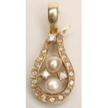 A PEARL AND DIAMOND PENDANT, the asymmetrical horseshoe panel pave set with numerous small