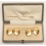 A PAIR OF 18CT GOLD OVAL CUFFLINKS, engraved with an armorial, 11.9g total, cased, together with a