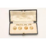 A COMPOSITE SET OF FOUR DRESS STUDS, the circular facet cut citrine coloured studs each centred by a