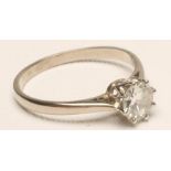 A SOLITAIRE DIAMOND RING, the brilliant cut stone of approximately 0.65cts, claw set to a plain 18ct